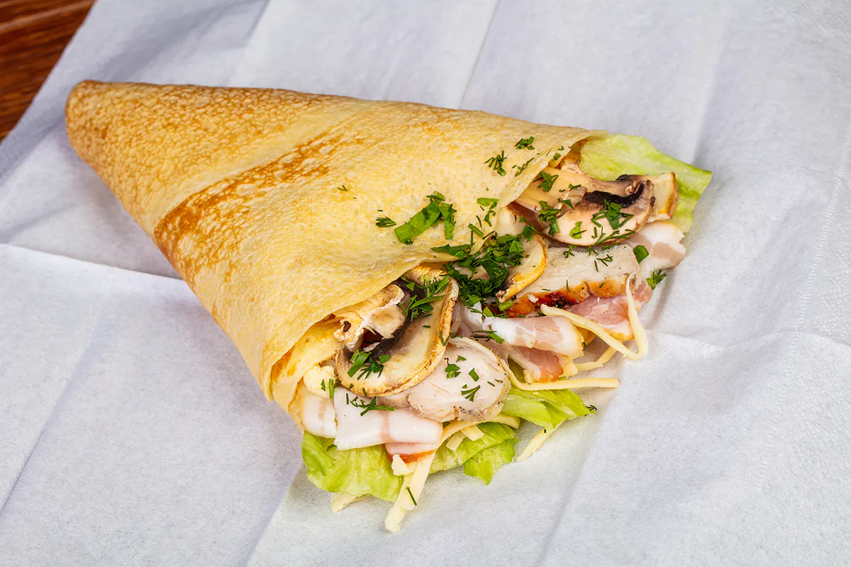 Savory crepe filled with chicken, bacon, mushrooms, lettuce, cheese, and fresh herbs at Me + Crêpe, a Chinese Restaurant in Pasadena